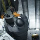 Worker assembling components inside a nuclear microreactor during construction