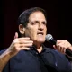 Mark Cuban speaking into a microphone at an event