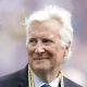 Mark Walter at a sporting event wearing a lanyard