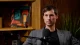 Reed Jobs seated in front of a microphone during an interview