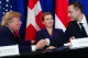 Trump shaking hands with Danish officials at a signing event