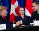Trump shaking hands with Danish officials at a signing event